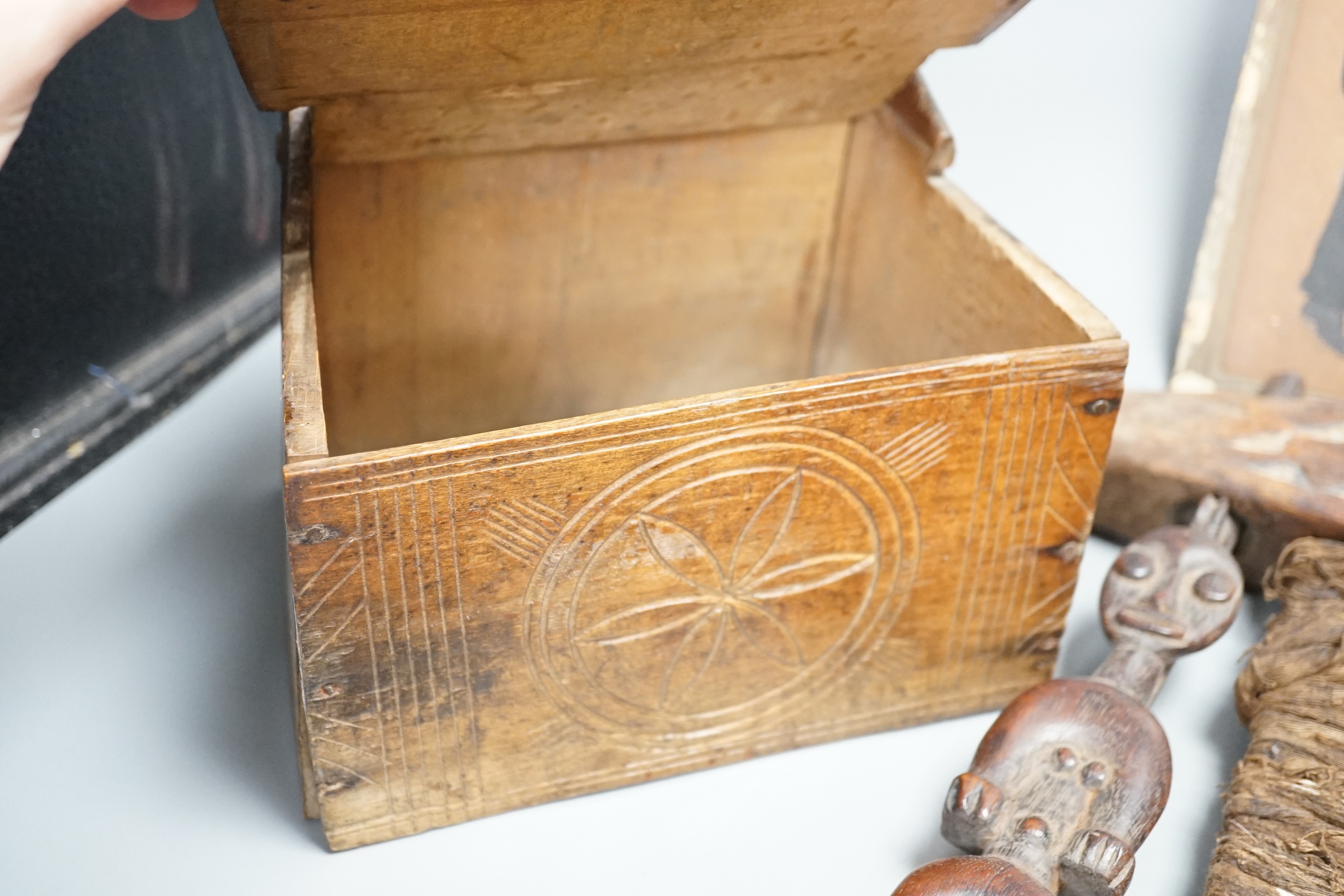 African carved wood instrument, chip carved beech box, a GWR brass wall lamp and a pair of oil portraits of H Belloc and HG Wells